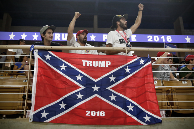 Brandon Miles, Brandon Partin and Michael Miles cheer before Republican U.S. presidential nominee Donald Trump attends a campaign rally at the Silver Spurs Arena in Kissimmee, Florida